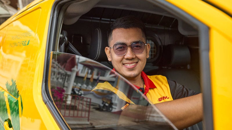 DHL Express employee delivering goods shipped from Indonesia to the USA