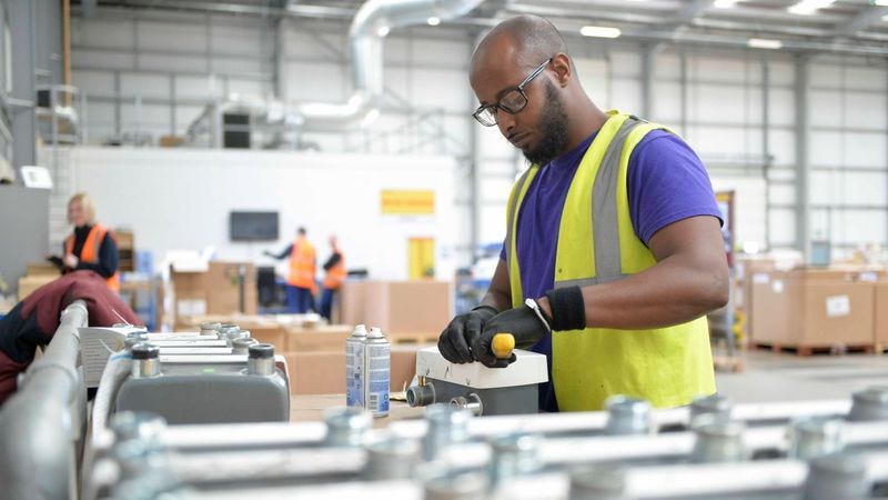 worker preparing dangerous goods for shipping