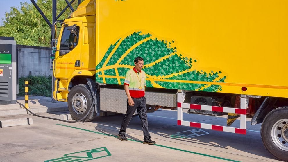 Electric DHL truck parked at the charging station