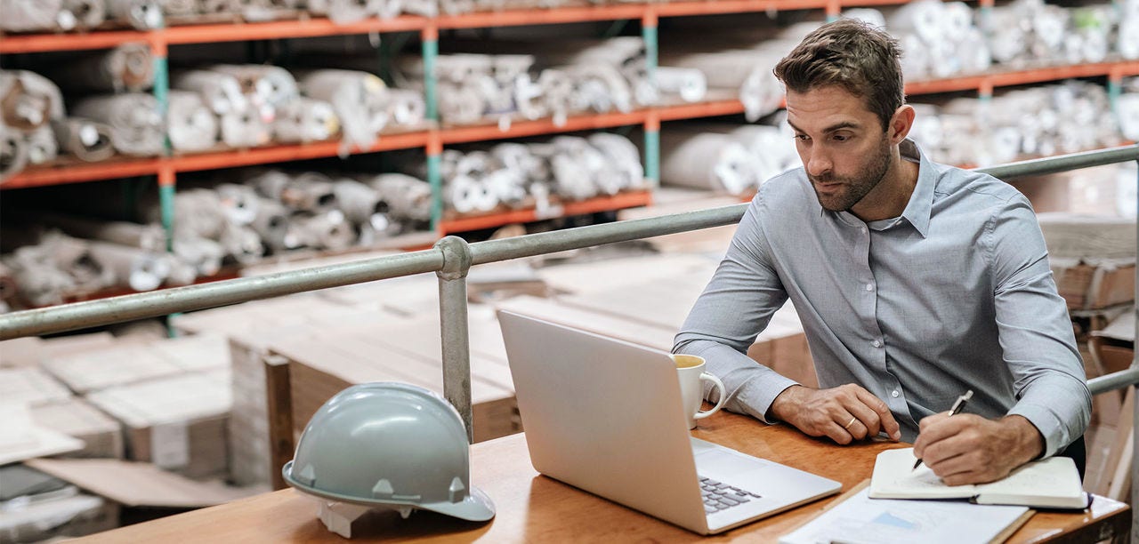 man looking at laptop screen