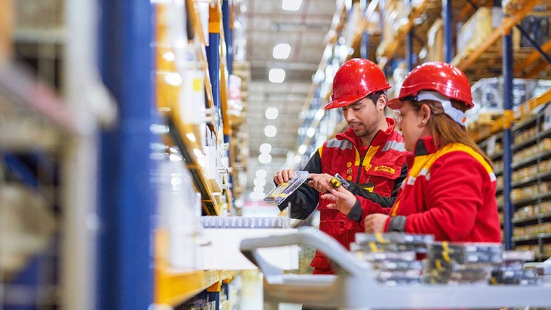 DHL employees working in the warehouse
