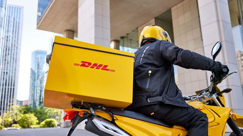 dhl express courier delivering items during the peak season