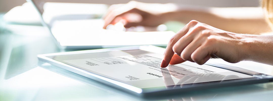 hand swiping on tablet