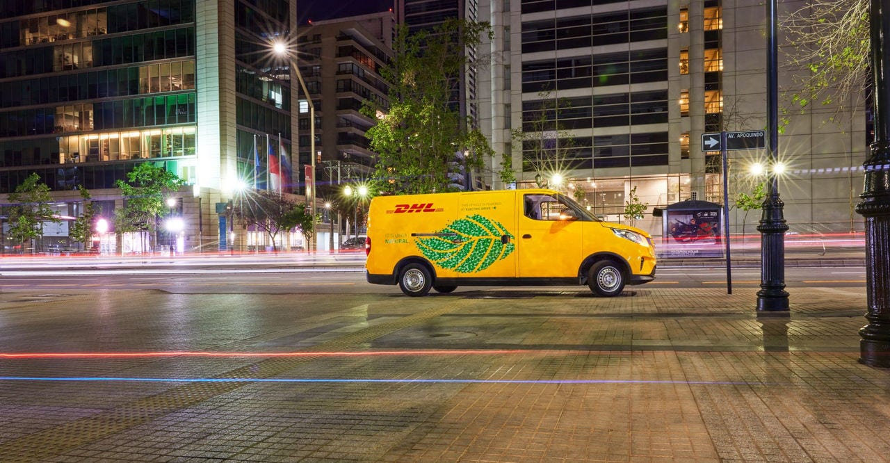 an electric dhl van providing sustainable logistics solutions in an unidentified city