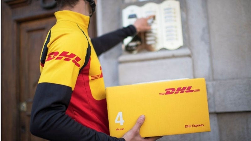 Inline Static ( 800x450)  - Courier with package by front door.