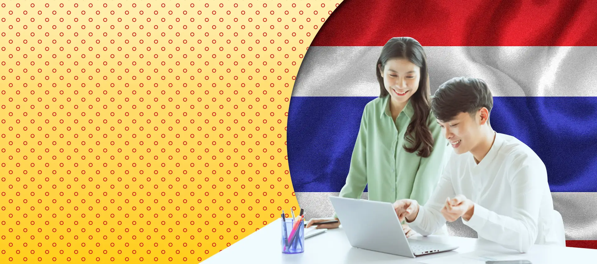 man and woman smiling at laptop screen