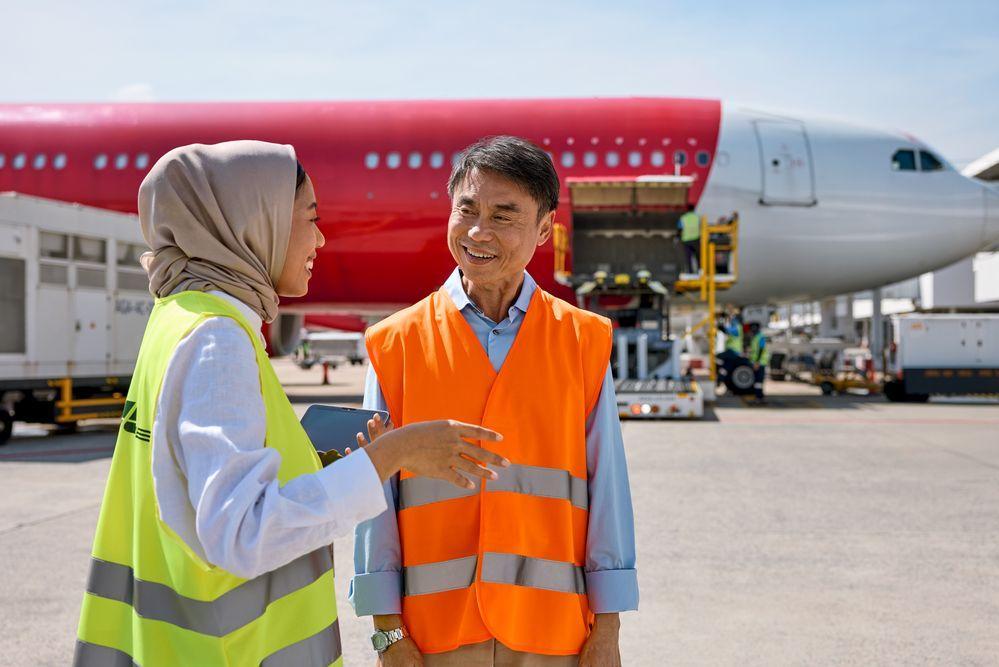 dhl staff talking to japanese business partner