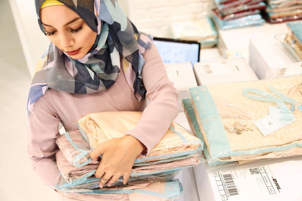business owner preparing shipment of clothes
