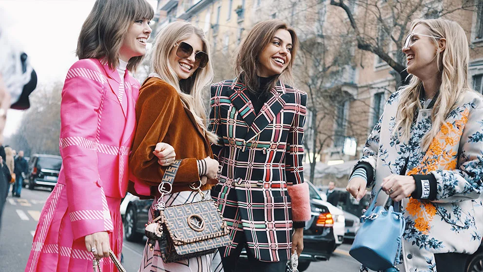 women smiling at each other