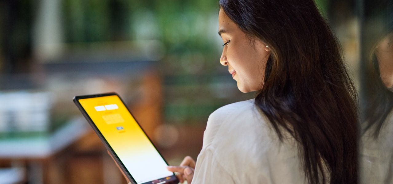 A female DHL employee, attentively looking 