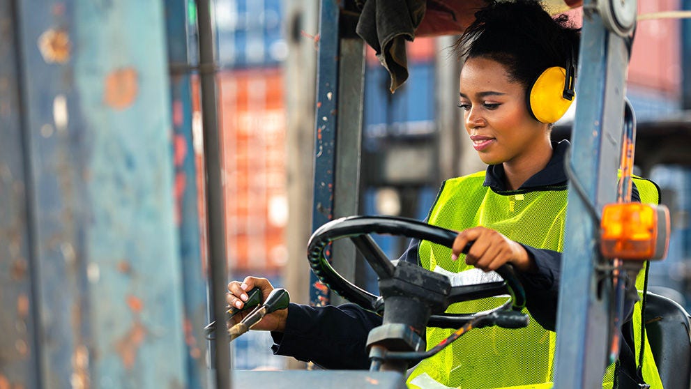 woman operating a forklift