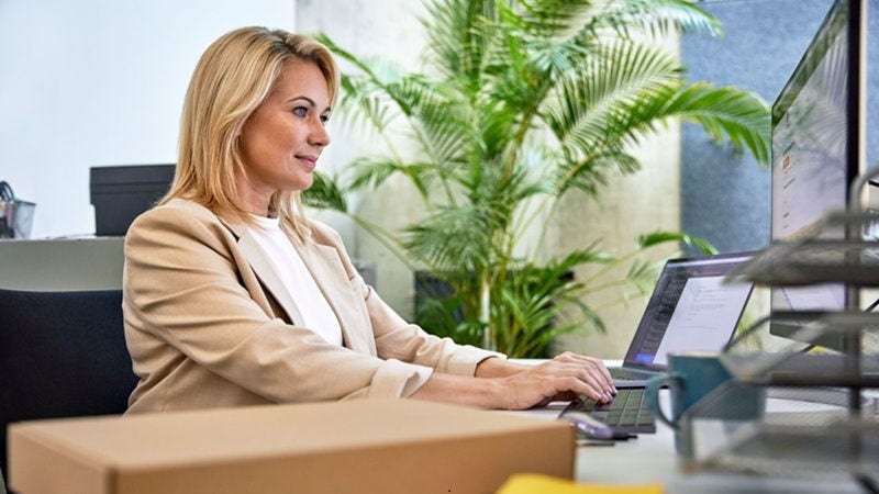 Business customer working in front of a computer at home.
