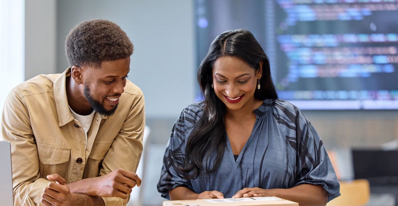 two customers unwrap dropshipped parcel