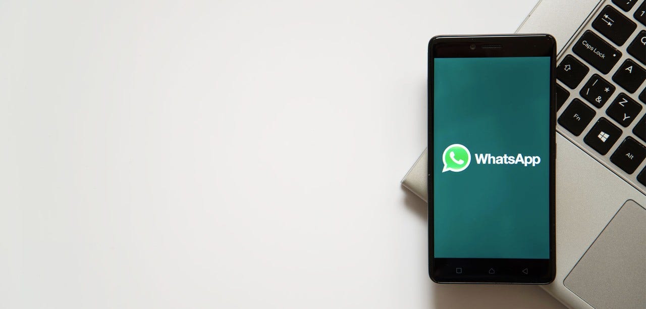 mobile phone with Whatsapp logo