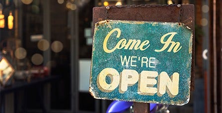come in we're open sign