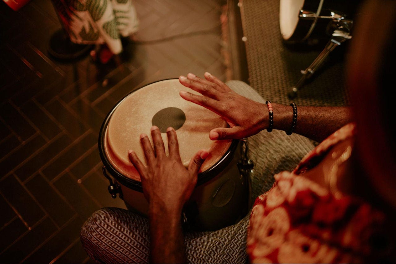 Man playing a traditional Pakistan music instrument