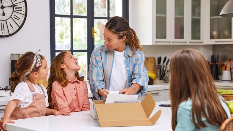 Family opening a package of souvenirs from Japan