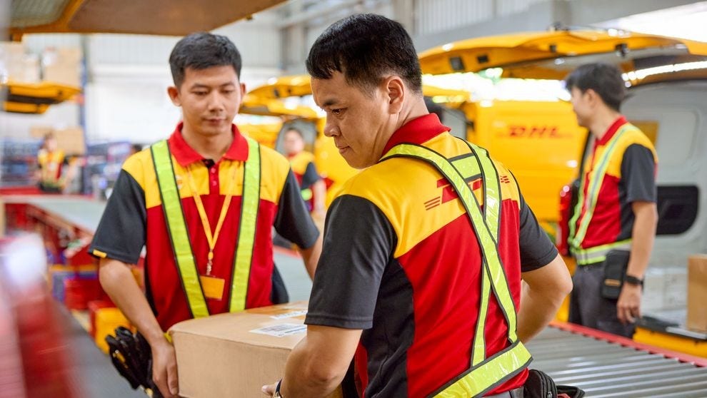 DHL employees loading the electronics before sending to recipients in China