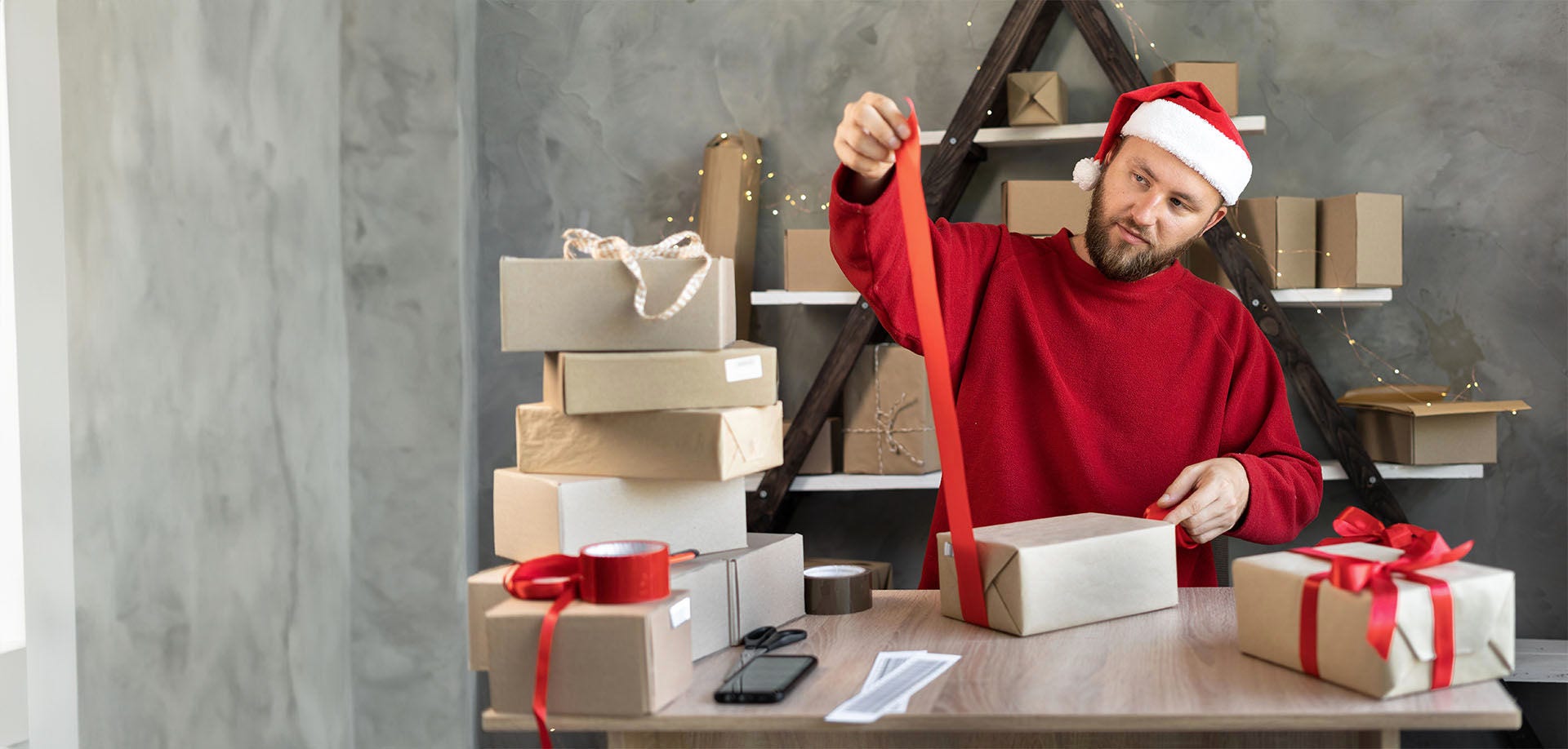 man wrapping parcel