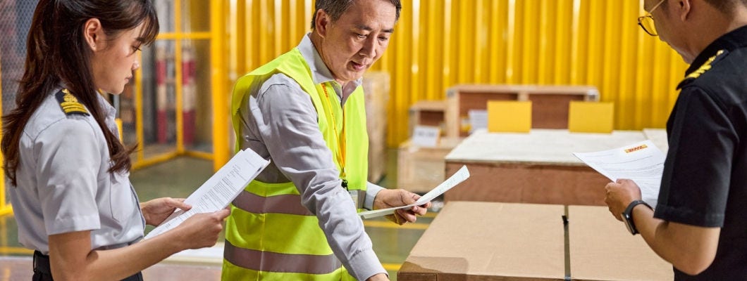 customs_02.jpg dhl employees talking to customs officers