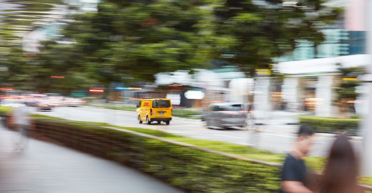 dhl express courier in van providing fast shipping services in indonesia