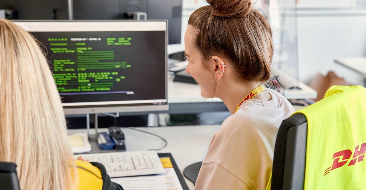 dhl staff looking at their monitor