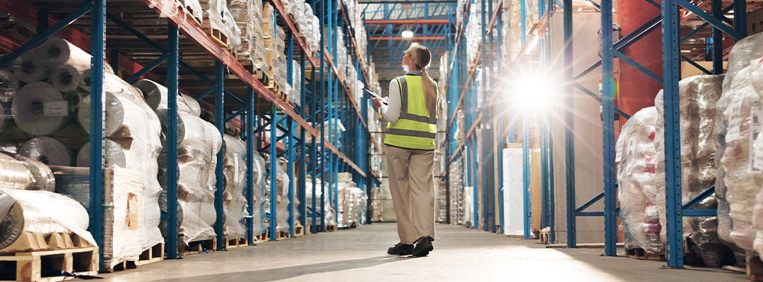 Woman, back and contractor with tablet in logistics for store management, inventory or checking stock at warehouse. 