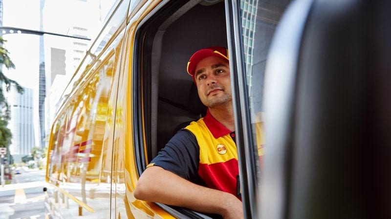 DHL employee driving for the next temperature-sensitive product delivery