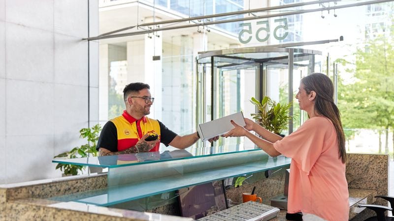 dhl employee delivering an order to an overseas customer