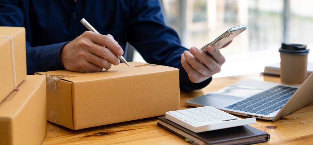 reviewing information to mark boxes for shipping to the US