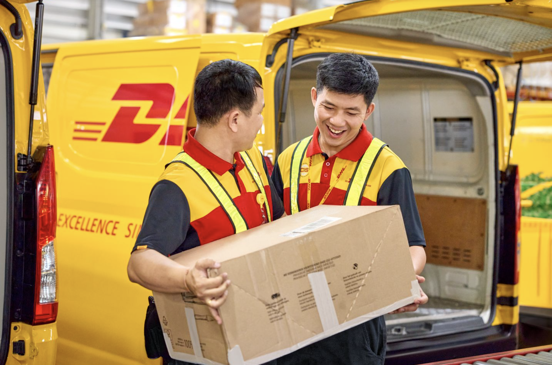 DHL Express employees handling parcel for intra-Asia shipping