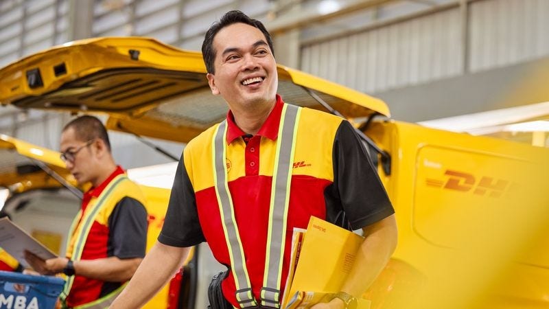 DHL staff preparing shipment for international delivery