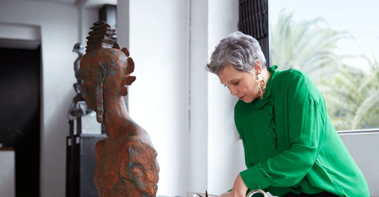 art gallery owner packing fragile artwork for shipping