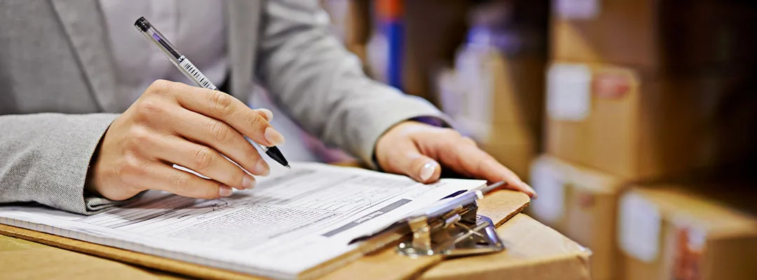 hand writing on clipboard