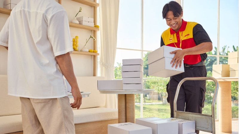 dhl express courier carrying out parcel pickup service for international delivery