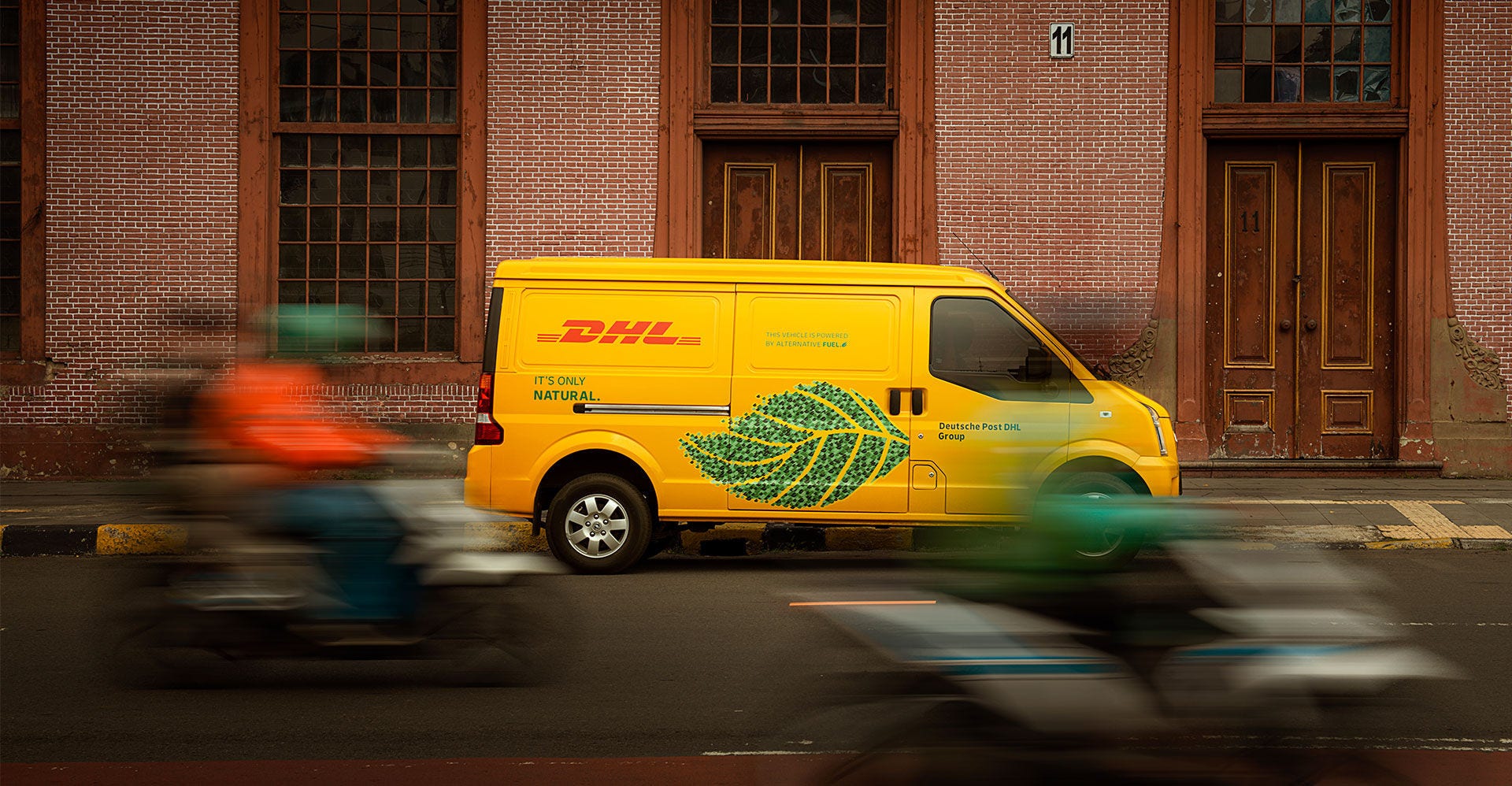 a dhl delivery van showcasing the sustainability of electric vehicles in the logistics industry