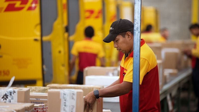 Packages arriving at a DHL Express warehouse
