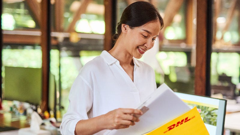 a business owner preparing a commercial invoice for international shipping