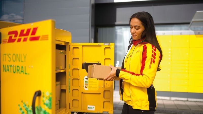 dhl express courier picking up a dropshipping package for last-mile delivery
