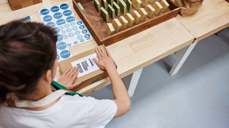 business preparing a parcel with a prepaid returned label