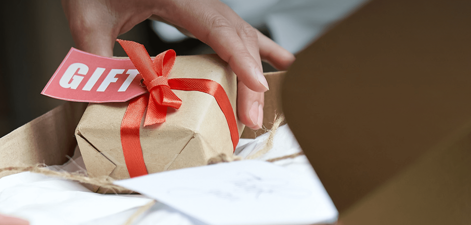 hand reaching for a gift box