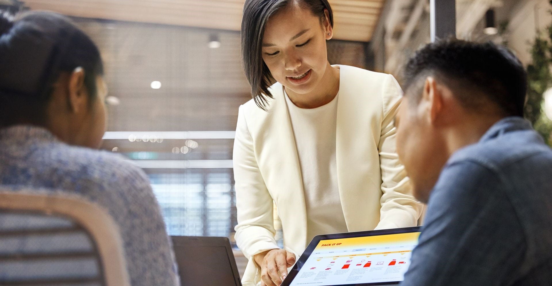 dhl express employee showing the role of ai in e-commerce to business owners