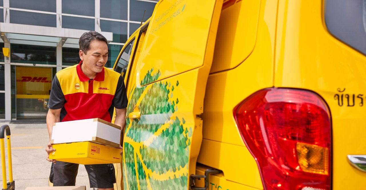 dhl employee loading parcels for export to bangladesh from india