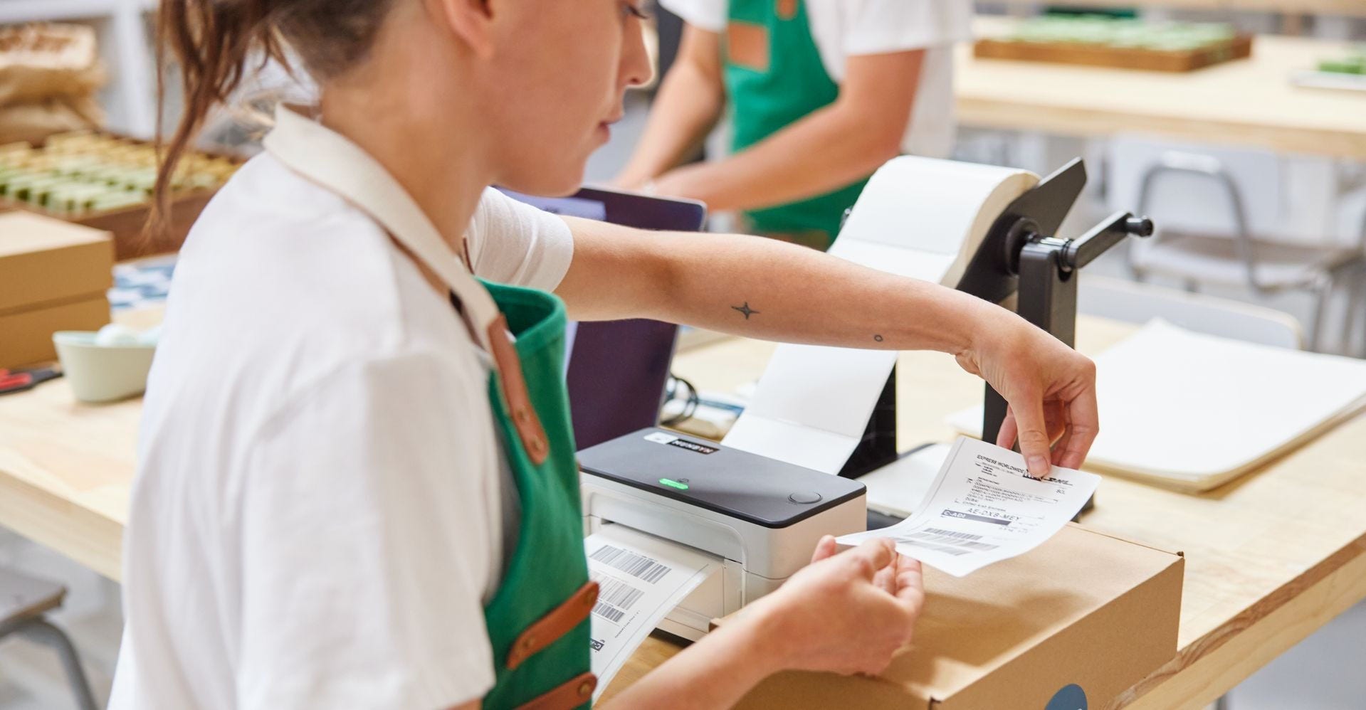 woman applying shipping label to parcel for dhl express