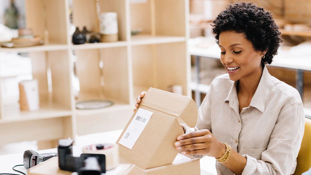 woman opening package