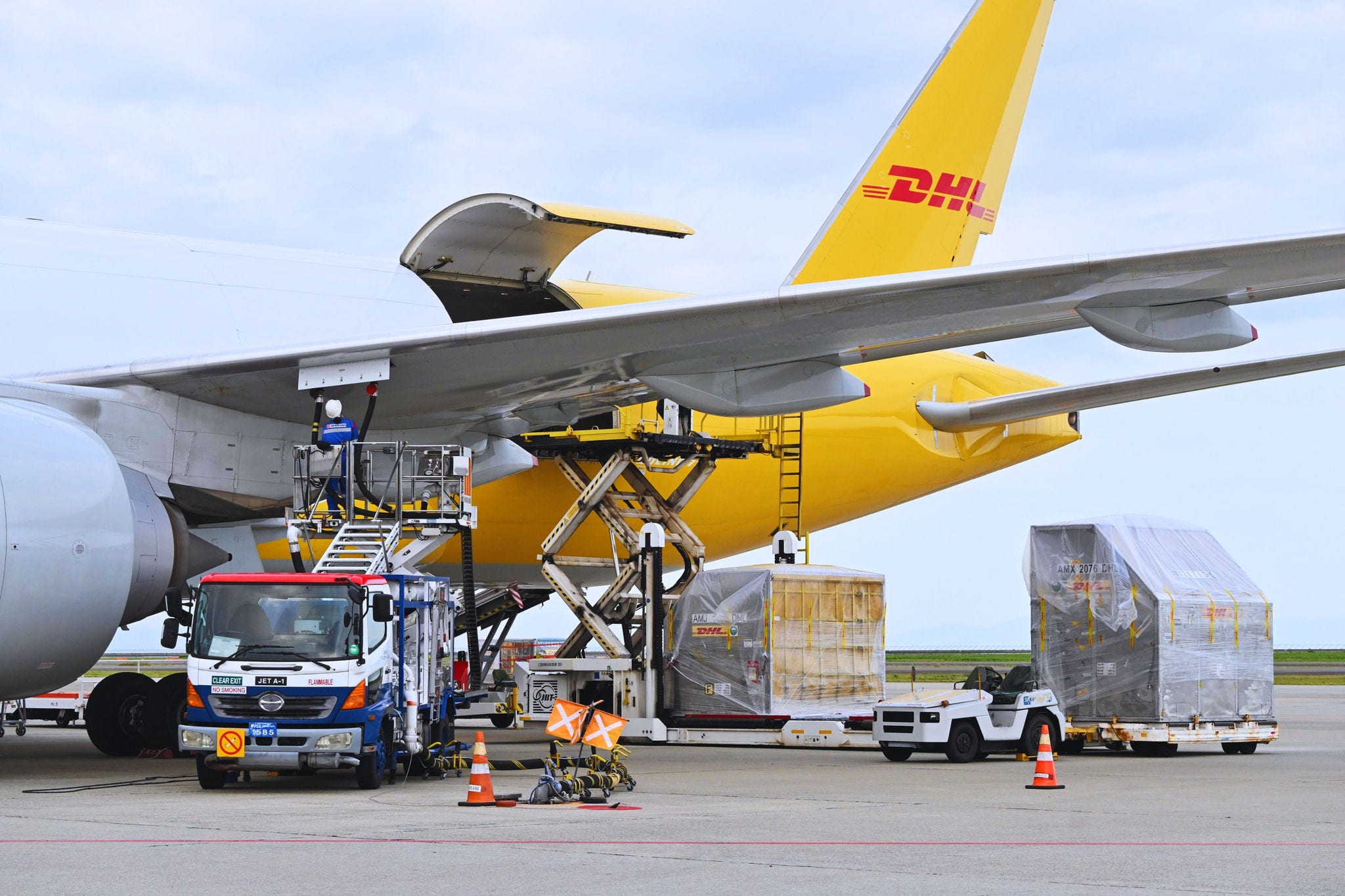DHL aircrafts in the ariport to be filled with SAF. 