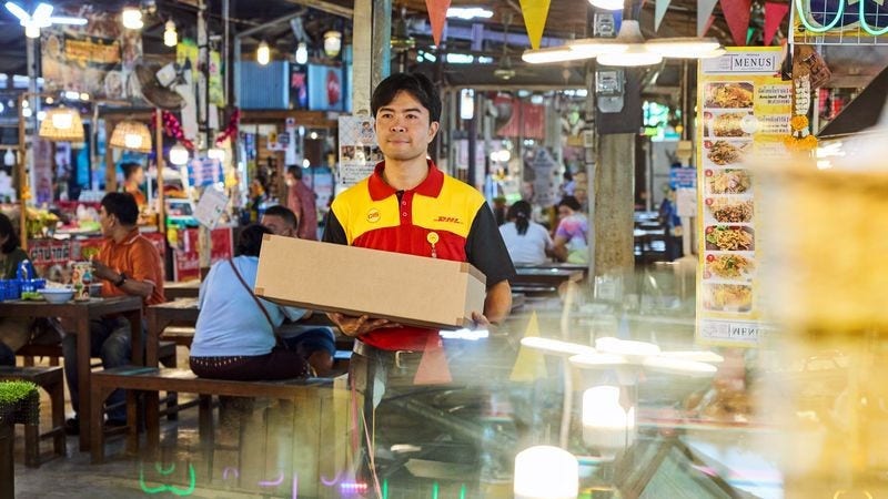 dhl express employee delivering Cambodia’s export products to customers abroad