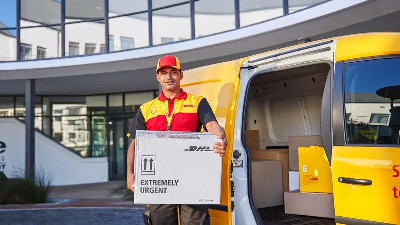dhl express employee making a same-day delivery for medical supplies