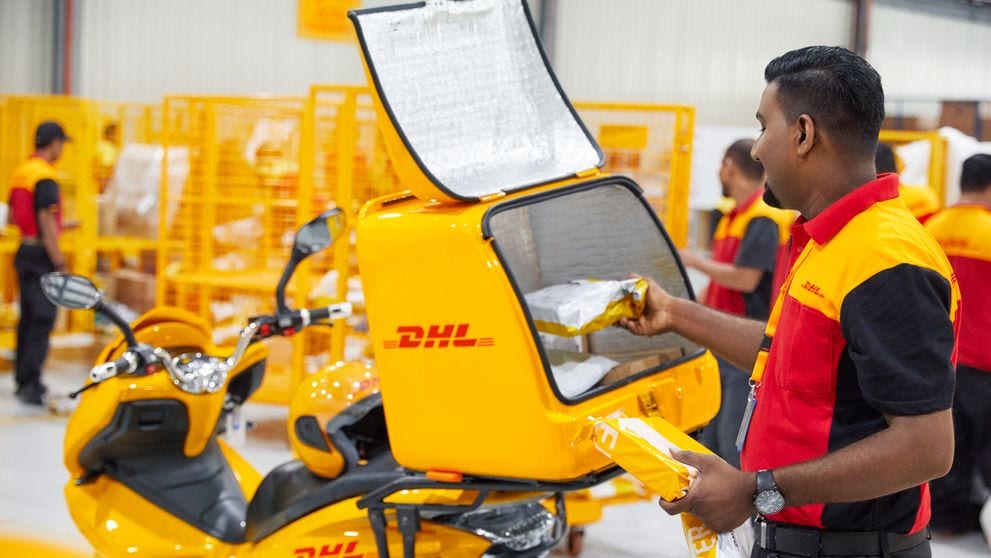dhl logistics employee handles bangladesh export products for intra-asia trade markets