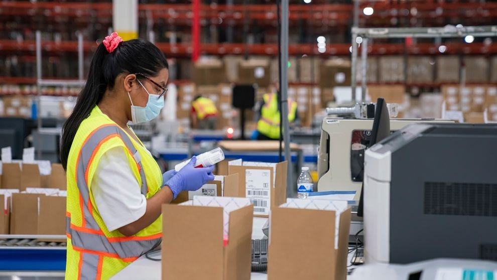 A dhl express employee inspecting the contents of a parcel